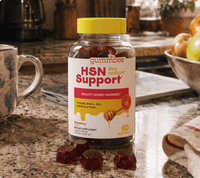 Bee Radiant hair, skin and nails honey gummies bottle on a kitchen counter